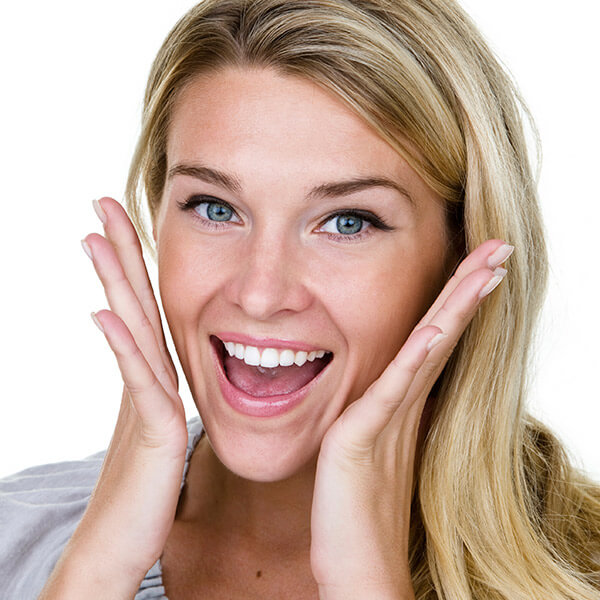 A young woman excited showing her new smile.